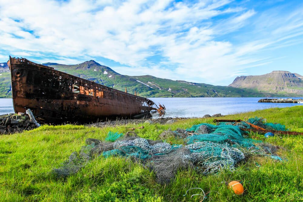 Old rusty boat in Djupavik village Westfjords in Iceland.