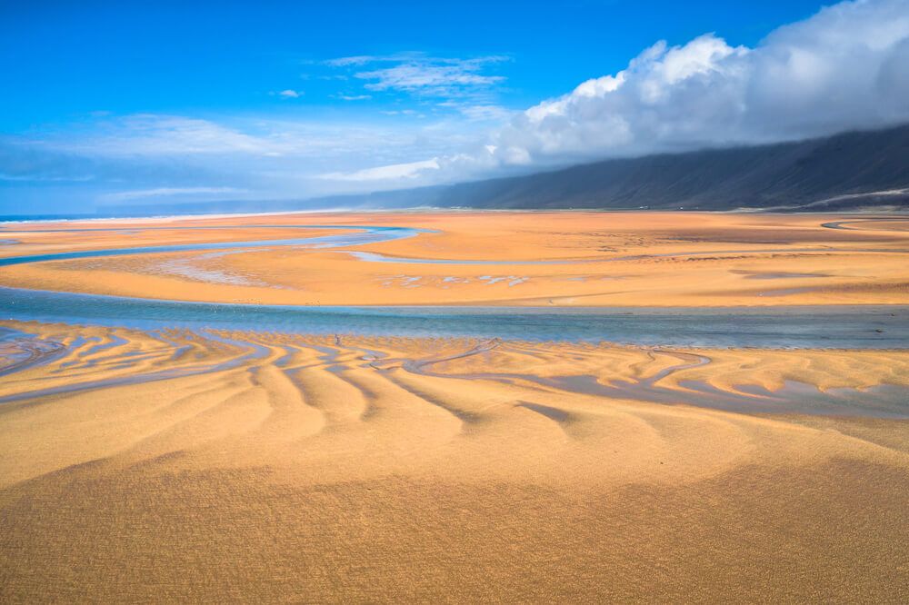 Red beach sand at Iceland Westfjords.