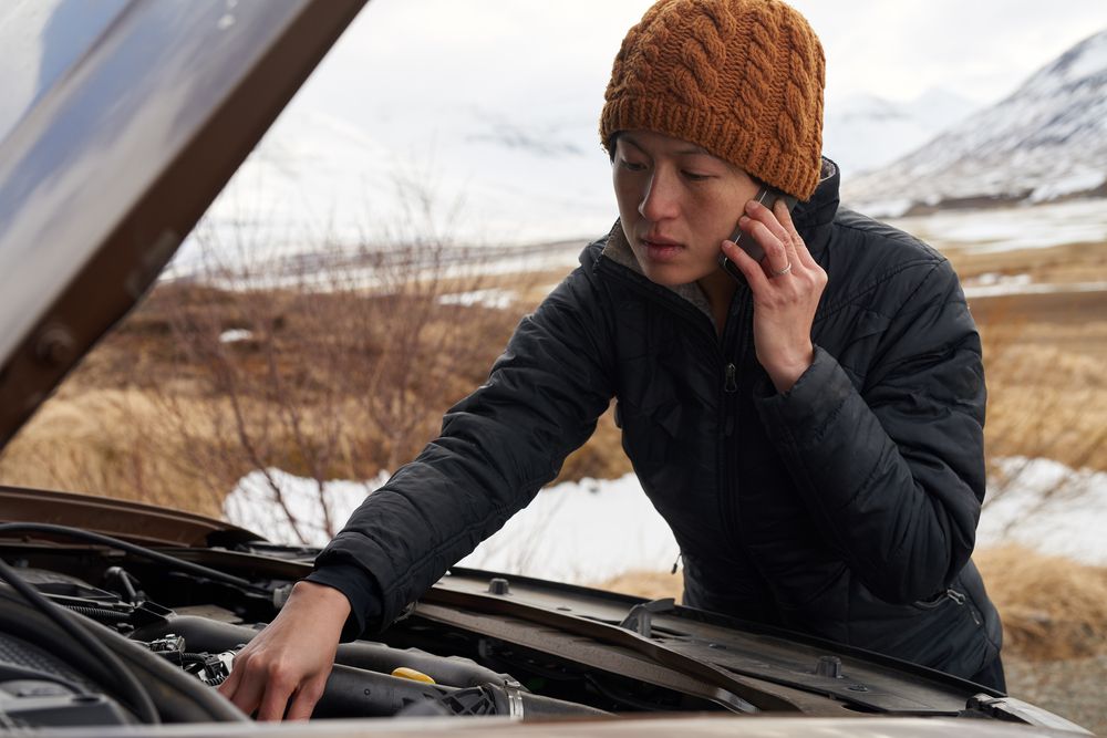 Traveler calling for roadside assistance in remote Iceland